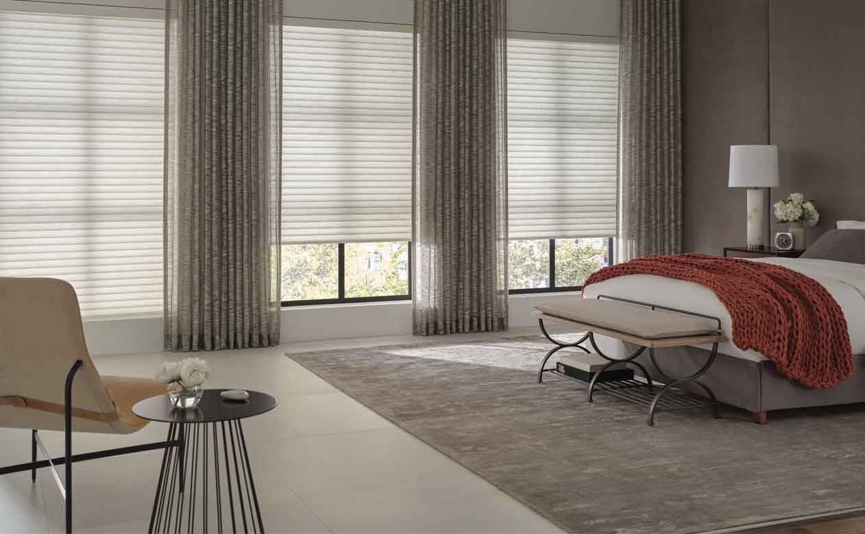 hunter douglas grey shades and curtains in bedroom